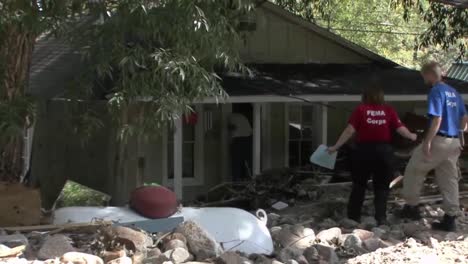 Fema-Relief-And-Aid-Workers-Interview-Homeowners-Following-A-Disastrous-Flood-1