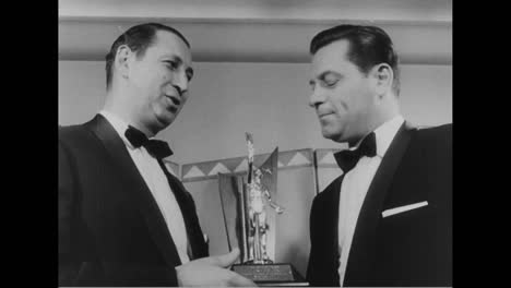 William-Holden-Receives-The-Sear-Of-The-Year-Award-From-The-Theatre-Owners-Of-America-In-1956