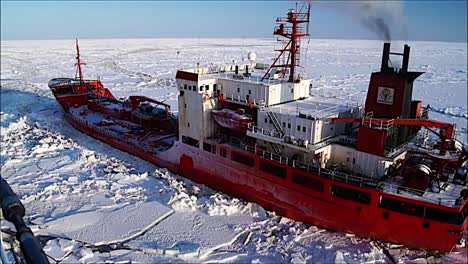 A-Coast-Guard-Icebreaker-Ship-Cuts-A-Path-Through-Arctic-Ice-For-A-Cargo-Vessel-1