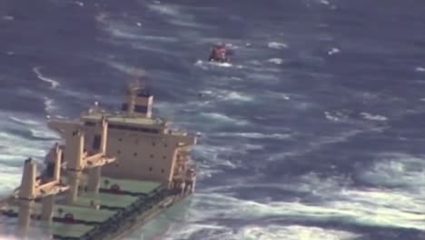 News-Footage-Of-The-Coast-Guard-Flying-Above-A-Cargo-Ship-On-The-High-Seas-And-Rescuing-Or-Airlifting-A-Crewman-3
