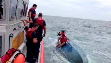 Four-Men-Are-Rescued-By-The-Coast-Guard-From-A-Capsized-Boat-Off-Siesta-Beach-Florida-1
