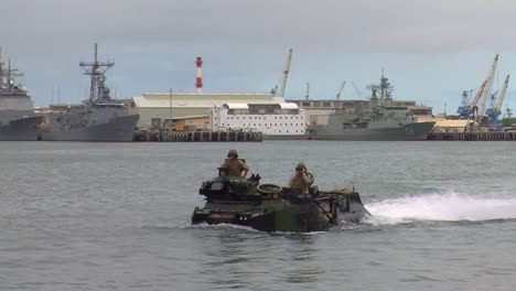 Amphibious-Armored-Assault-Vehicles-Are-Driven-Across-A-Bay-And-Onto-A-Ship
