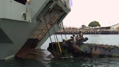 Amphibious-Armored-Assault-Vehicles-Are-Driven-Across-A-Bay-And-Onto-A-Ship-1