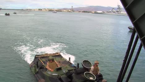 Amphibious-Armored-Assault-Vehicles-Are-Driven-Across-A-Bay-And-Onto-A-Ship-4