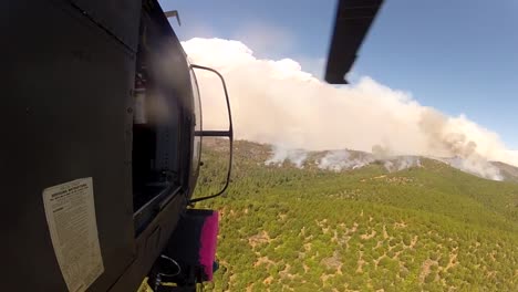 A-Helicopter-Flies-Towards-A-Forest-Fire