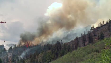 A-Helicopter-Makes-Water-Drops-On-A-Forest-Fire-3