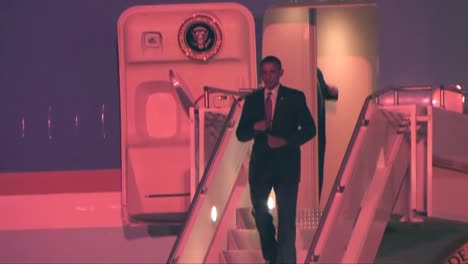 Barack-Obama-Emerges-From-Air-Force-One-At-Night