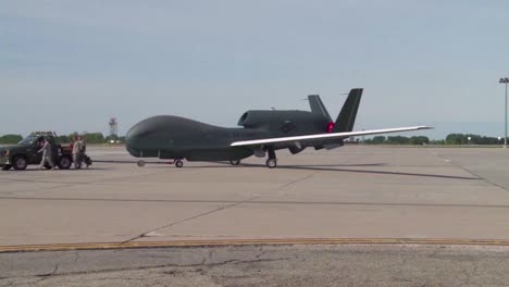 A-Rq4-Surveillance-Drone-Is-Rolled-Out-Onto-A-Runway-By-Military-Personnel-1