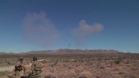 An-F35-Lightning-Bombs-Targets-In-The-Desert-While-Soldiers-Look-On-1