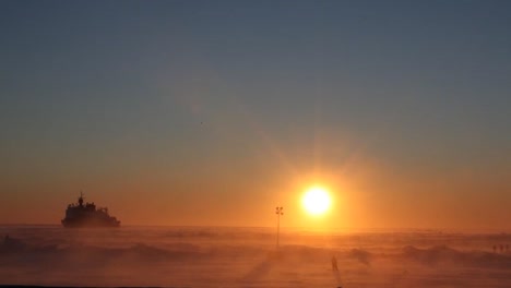 Blizzard-Conditions-Engulf-An-Ice-Floe-With-A-Us-Coast-Guard-Ship-Distant