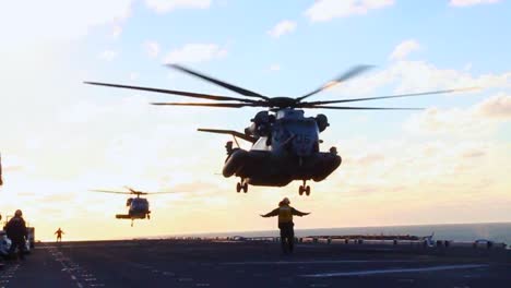 Helicopters-Land-On-The-Deck-Of-An-Aircraft-Carrier-During-Search-And-Rescue-Operations-Of-Hurricane-Sandy