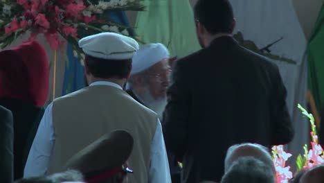 Afghan-Government-And-Military-Officials-Pray-In-A-Large-Hall-For-A-Speech