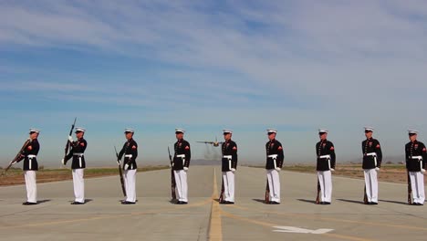 Us-Marine-Honor-Guard-Performs-As-Plane-Does-A-Flyover