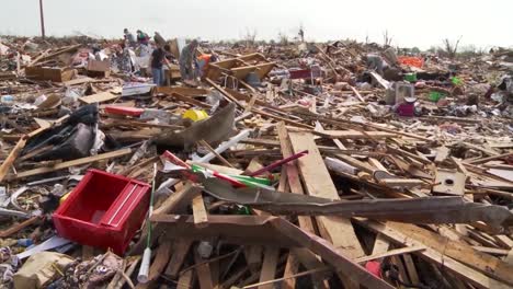 Residents-Pick-Through-The-Ruins-Of-Their-Homes-After-The-Devastating-2013-Tornado-In-Moore-Oklahoma-8
