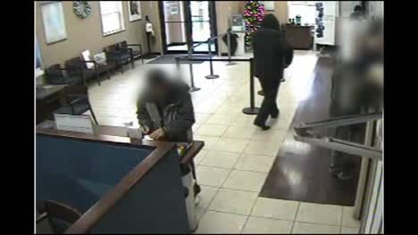 Surveillance-Camera-Footage-Of-An-Armed-Robber-Robbing-A-Bank