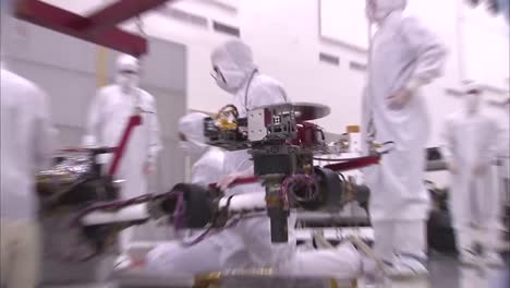 Nasa-Scientists-Work-In-The-Lab-To-Mount-The-Robotic-Arm-Of-The-Mars-Rover