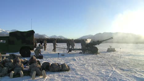 A-Piece-Of-Artillery-Is-Fired-In-A-Snowy-Landscape