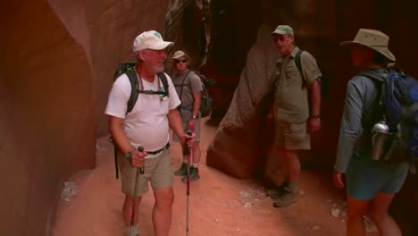 Tourists-Admire-Paria-Canyon-Arizona-And-Rock-Carvings-And-Slot-Canyons-2