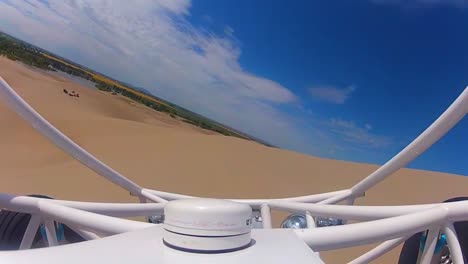 Exciting-Pov-Shot-Of-A-Dune-Buggy-Across-Sand-Dunes-1