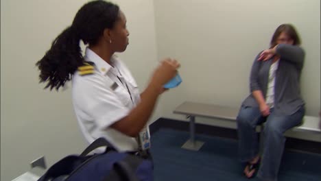 A-Traveler-Is-Inspected-For-Disease-By-A-Cdc-Official-During-Quarantine-At-An-Airport