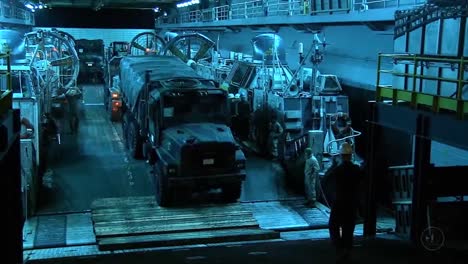 Expeditionary-Units-Are-Loaded-Into-The-Hull-Of-A-Navy-Ship-In-Preparation-For-War