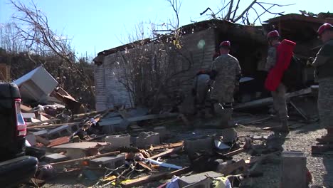 National-Guard-Soldiers-Patrol-A-Neighborhood-In-West-Liberty-Kentucky-Following-A-Devastating-Tornado-1
