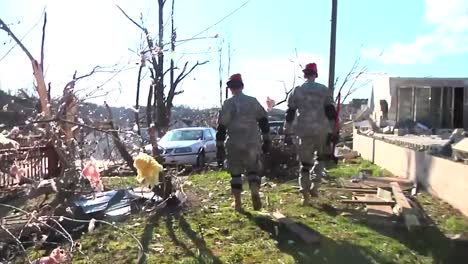 National-Guard-Soldiers-Patrol-A-Neighborhood-In-West-Liberty-Kentucky-Following-A-Devastating-Tornado-3