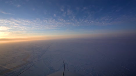 Pov-Shot-From-The-Front-Of-A-Plane-Flying-Over-Frozen-Arctic-Tundra-1