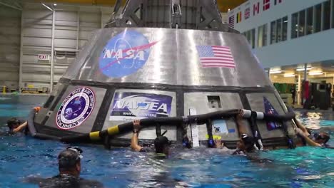 Nasa-Engineers-Practice-Splashdown-Rescue-With-The-Orion-Capsule-At-The-Johnson-Space-Center
