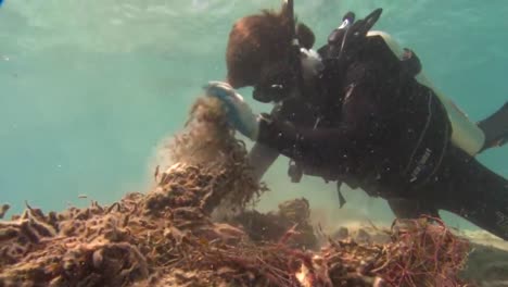 Divers-Work-To-Remove-Tangled-Fishing-Nets-From-Coral-Reefs-Near-Hawaii