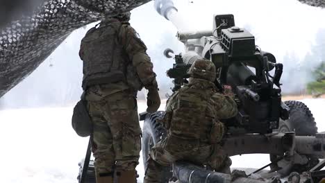 Us-Army-Artillery-Soldiers-Fire-A-Massive-Howitzer-Cannon-Gun-On-The-Battlefield
