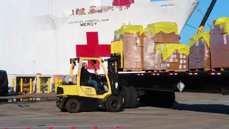 Surgical-Masks-And-Gowns-And-Other-Protective-Medical-Supplies-Are-Trucked-To-The-Us-Navy-Mercy-Hostpital-Ship-During-Covid19-Coronavirus-Outbreak-Epidemic-2