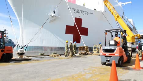 Us-Navy-Hospital-Ship-Mercy-Is-Loaded-Dockside-With-Goods-To-Fight-The-Coronavirus-Covid19-Virus-Outbreak