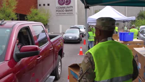 During-The-Covid19-Coronavirus-Epidemic-Outbreak-Members-Of-The-Armed-Forces-Hand-Out-Groceries-At-A-Food-Bank-In-Arizona-1