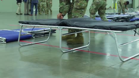 Maryland-National-Guardsmen-Set-Up-Beds-And-Cots-At-An-Emergency-Hospital-During-The-Coronavirus-Covid19-Outbreak-Epidemic-1