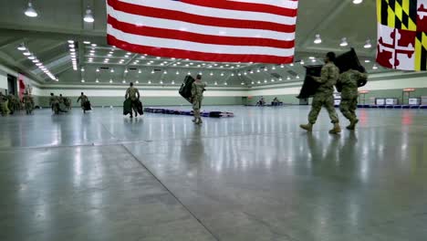 Maryland-National-Guardsmen-Set-Up-Beds-And-Cots-At-An-Emergency-Hospital-During-The-Coronavirus-Covid19-Outbreak-Epidemic-2