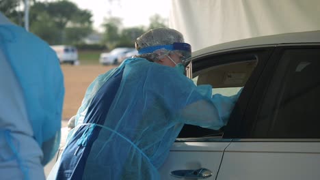 Covid19-Coronavirus-Patients-Are-Tested-At-A-Drive-Thru-Clinic-Gowns-Masks-And-Test-Kits-Shown-1