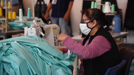 Private-Companies-Start-To-Make-Gowns-And-Masks-In-Small-Factories-During-The-Coronavirus-Covid19-Pandemic-Outbreak-3