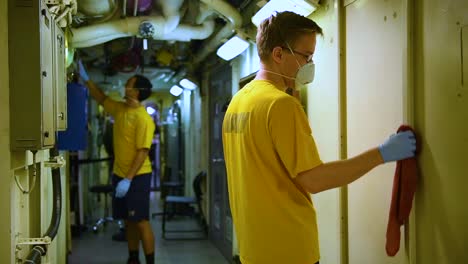 Sailors-Aboard-The-Aircraft-Carrier-Uss-Theodore-Roosevelt-Clean-Various-Spaces-With-Disinfectant-Bleach-During-The-Coronavirus-Covid19-Pandemic-Epidemic-Outbreak-2