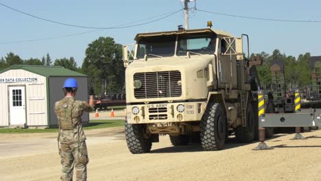 A-Tractor-Trailer-Of-the-1158th-Transportation-Company-Of-Wisconsin-National-Guard-Pulls-A-Flatbed-Trailer