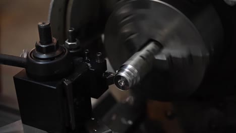 Slow-Motion-Of-Us-Air-Force-Airmen-Of-the-332-Aew-Use-A-Metal-Lathe-And-Cutting-Tools-In-their-Maintenance-Work