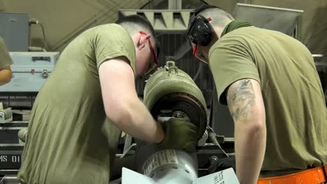 Us-Air-Force-Airmen-Of-332-Aew-Ammo-Shop-Assemble-Weapons-And-Munitions-For-A-Bombing-Mission-1