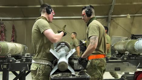 Us-Air-Force-Airmen-Of-332-Aew-Ammo-Shop-Assemble-Weapons-And-Munitions-For-A-Bombing-Mission-3