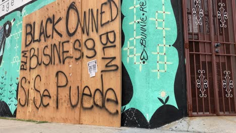 A-boarded-up-Los-Angeles-storefront-is-identified-as-a-Black-Owned-Business-during-rioting-and-looting-Black-Lives-Matter-protests--2