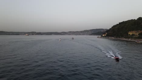 Aerial-View-Speed-Boat-During-Sunset