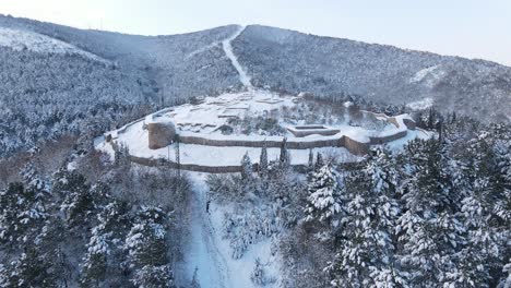 Aerial-View-Historical-City-Castle-Covered-Winter-Snow