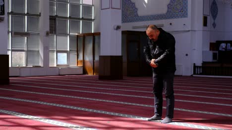 Middle-Aged-Man-Prays-in-Mosque-1