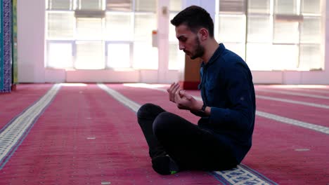 Man-Raising-His-Hands-And-Praying-In-Mosque