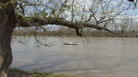 Illinois-man-in-boat-framed-by-tree