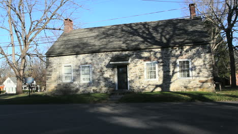 Trees-cast-shadows-on-the-stone-Freer-house-in-New-Paltz.